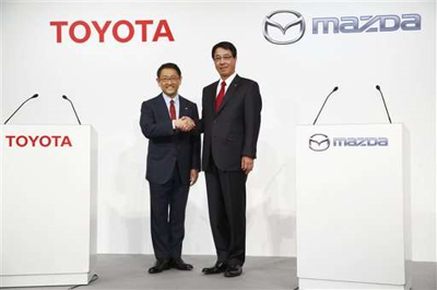 Toyota Motor Corp. president Akio Toyoda, left, and Mazda Motor Corp. President Masamichi Kogai.