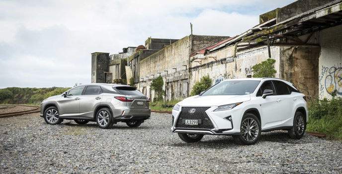 IMAGE – 2016 RX 450h Mid-Size Luxury Crossover in Titanium (left) and the RX 350 F Sport in White Nova (right)