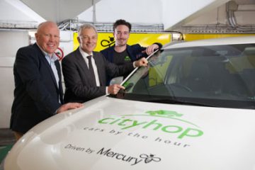 Auckland mayor Phil Goff, centre, at the extension of Mercury and Cityhop’s EV car-sharing trial. Goff drives an electric car.