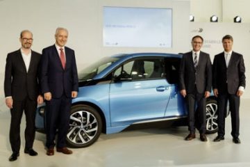 Celebrating the 100,000th BMW i3 from the Leipzig plant are, from left, BMW Group Energy Services head Joachim Kolling, Saxony prime minister Stanislaw Tillich, plant director Hans-Peter Kemser and chief executive officer Harald Kruger.
