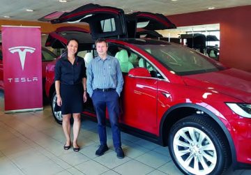 Bernard Bromell and Tesla NZ delivery operation specialist Ange Taylor.