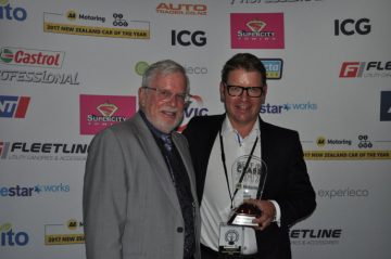 Stephen Glading of Protecta Insurance presents European Motor Distributors general manager Tom Ruddenklau with the medium/large car Best in Class award for the VW Arteon.