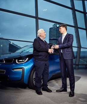 Wilhelm Schulten, 80, of Germany receives the keys to his BMW i3 at BMW Welt in Munich this week from Harald Kruger, making him the 100,000th customer worldwide to choose an electrified BMW Group vehicle this year.