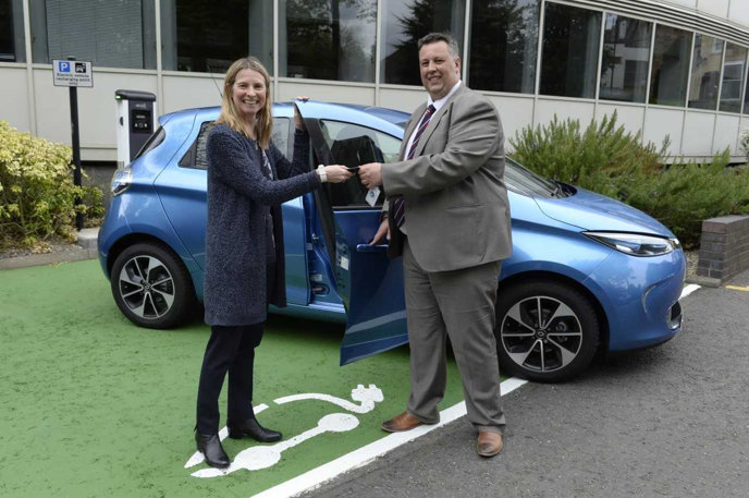 Matt Kiziuk hands a Renault Zoe to SNH chief executive officer Francesca Osowska.