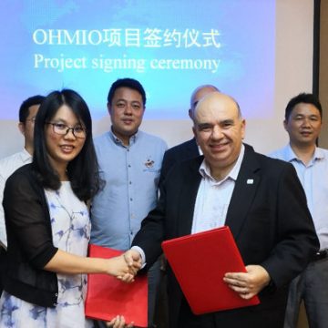 Mohammed Hikmet, front right, at the China signing