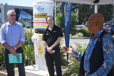 Kapiti Coast mayor K Gurunathan, right, opens the charger with Max Fieckert, left, and Karl Marryatt.