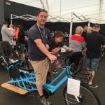 Eli Dobson and son Cooper, 2, check out a cargo e-bike.
