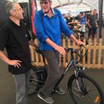 NZebikes director Andreas Steppat, left, advises a test rider.