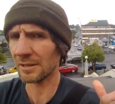 Niall Darwin indicates his Tesla parked outside the court house.