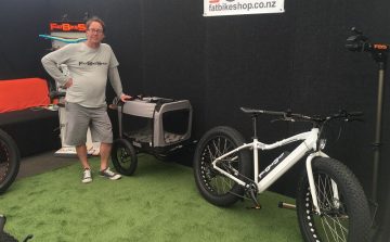 An e-bike pet carrier is shown by FatBikeShop representative Luke Ogier.