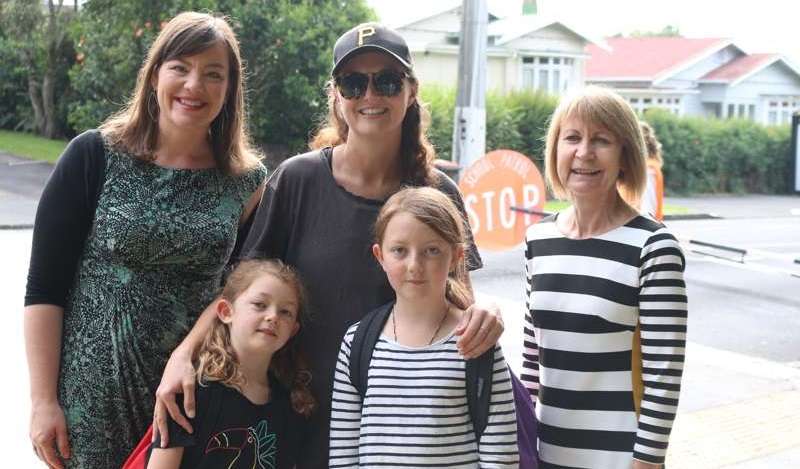 Julie Anne Genter centre at Owairaka School with principal and mum and kids