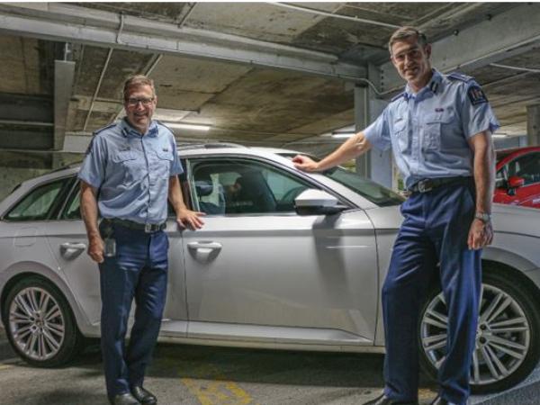 Police-commissioner-Andy-Coster-and-deputy-commissioner-Jevon-McSkimming-with-a-Skoda-cruiser.