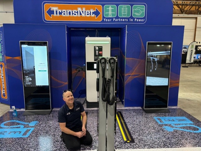 Glenn Inkster working on the TransNet stand at Electro Mobility Expo 2024