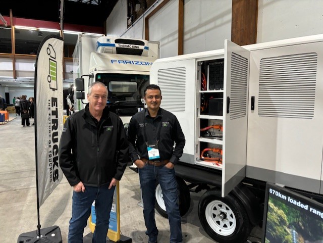 Ross Linton and Noel De Bruin at ETrucks stand with portable battery Electro Mobility Expo 2024
