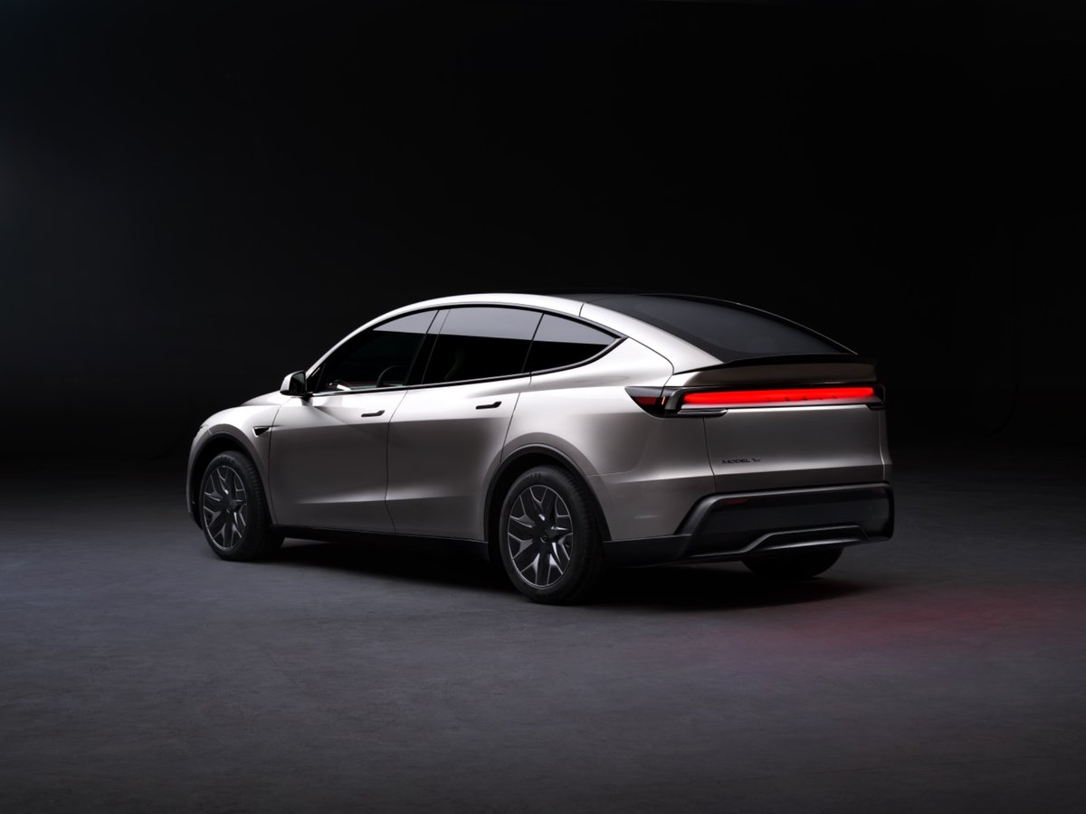 Rear three-quarter view of a silver Tesla Model Y