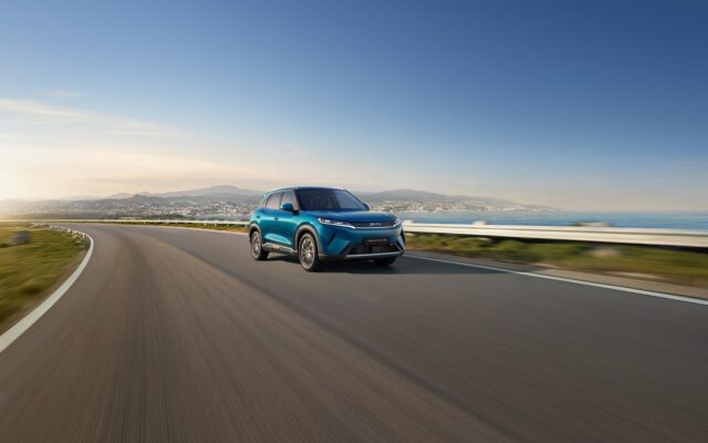 BYD Atto 2 DM-i plug-in hybrid driving on a coastal road