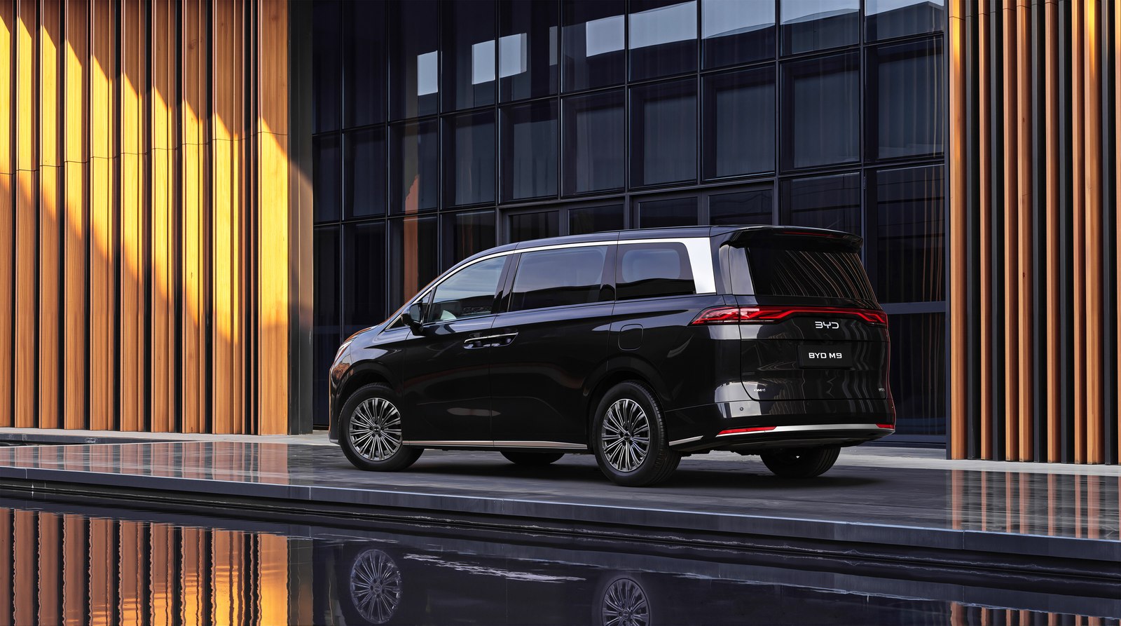 Black BYD M9 people mover rear three quarter