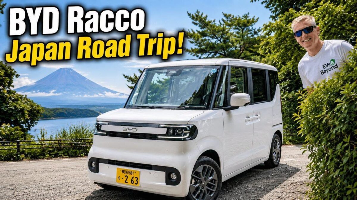 Gavin Shoebridge with a white BYD Racco kei car and Mt Fuji behind
