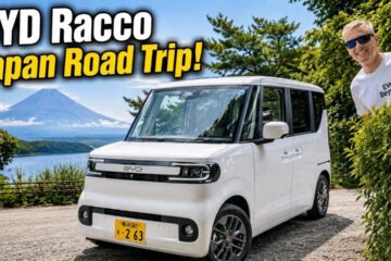 Gavin Shoebridge with a white BYD Racco kei car and Mt Fuji behind