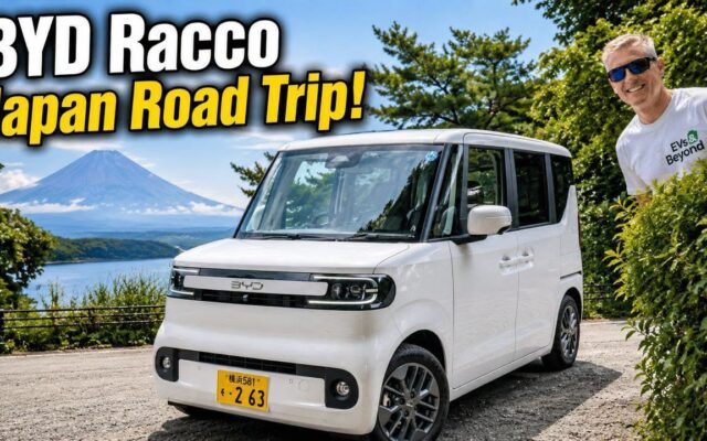 Gavin Shoebridge with a white BYD Racco kei car and Mt Fuji behind