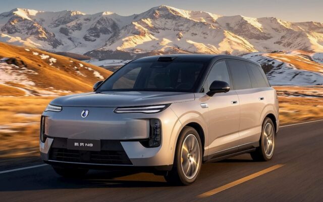 Denza N8 electric SUV driving on a mountain road