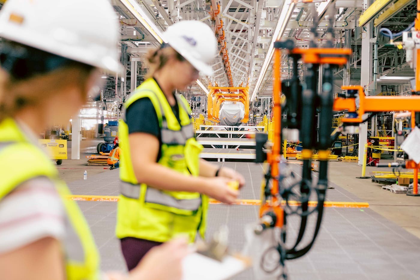Ford workers at a new UEV Production System workstation in Louisville