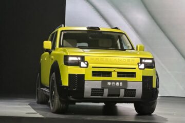 Freelander 8 boxy SUV front three quarter in yellow