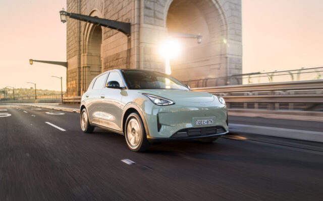 Geely EX2 Inspire driving near the Sydney Harbour Bridge