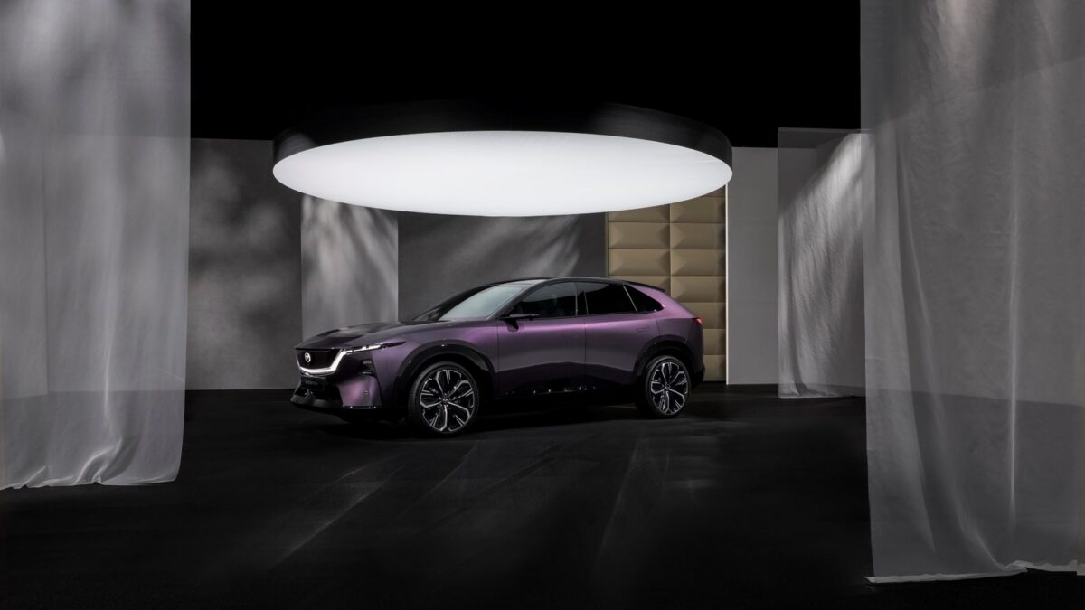 Mazda CX-6e electric SUV in purple, front three quarter
