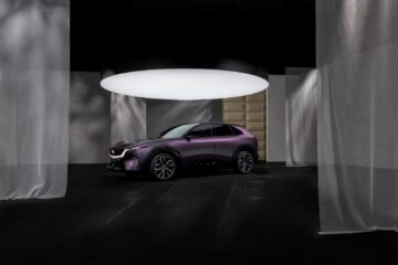 Mazda CX-6e electric SUV in purple, front three quarter