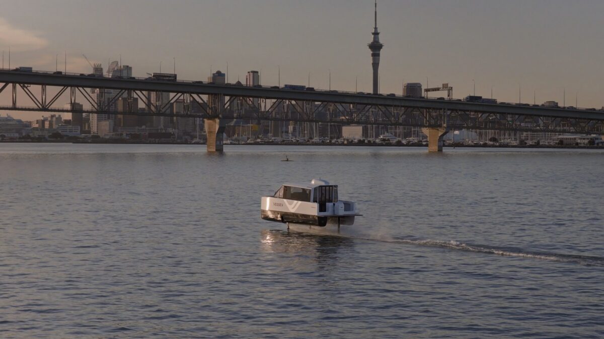 Vessev VS-9 electric hydrofoil foiling on Auckland harbour with the Sky Tower behind
