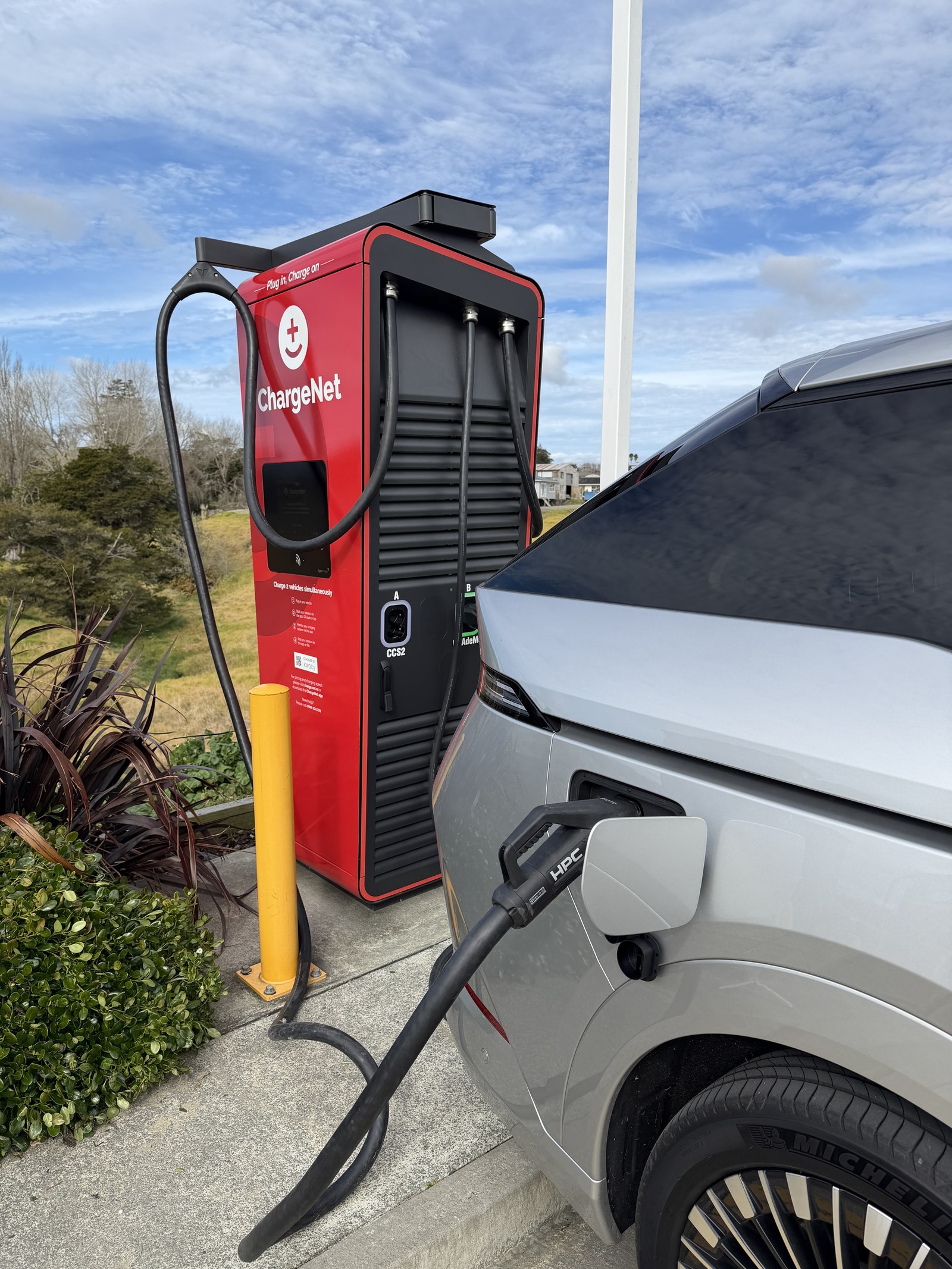 HPC connector plugged into the XPeng X9 at the Kaiwaka Alpitronic Hypercharger