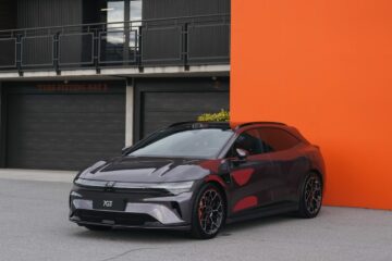 Maroon Zeekr 7GT parked against an orange wall at Highlands