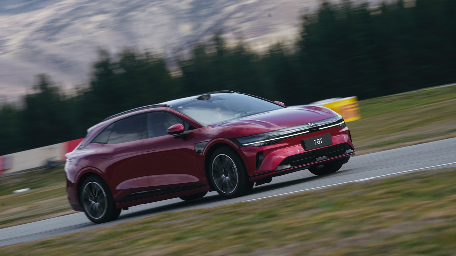 Red Zeekr 7GT cornering at speed at Highlands Motorsport Park