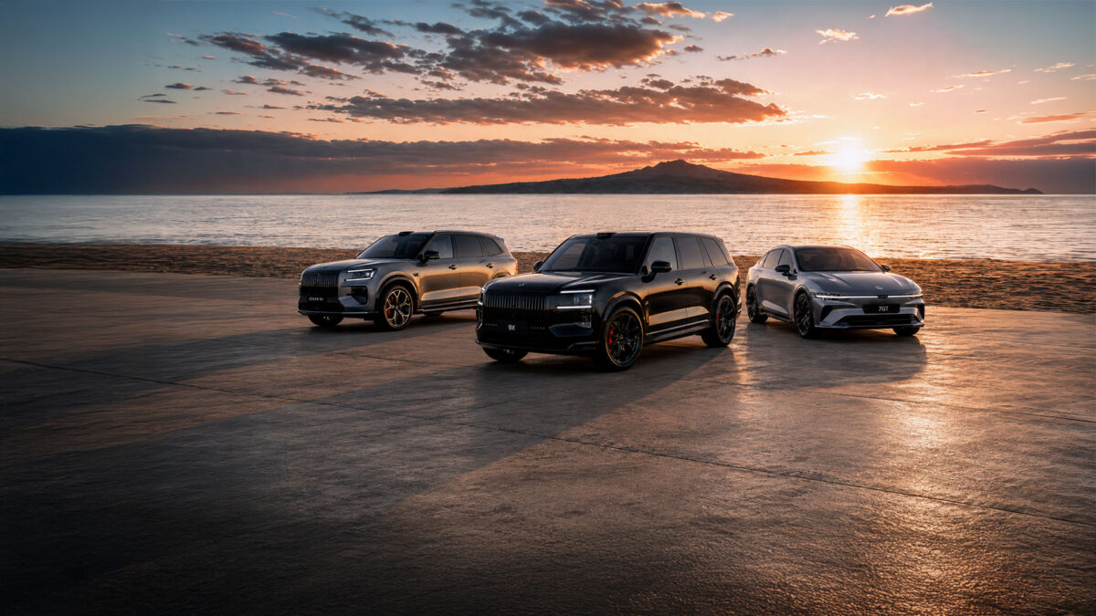 Zeekr 8X, 9X and 7GT parked at a beach at sunset with Rangitoto Island in the background