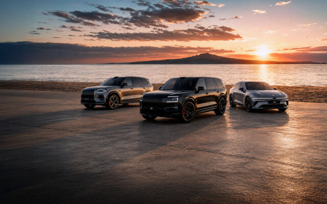 Zeekr 8X, 9X and 7GT parked at a beach at sunset with Rangitoto Island in the background