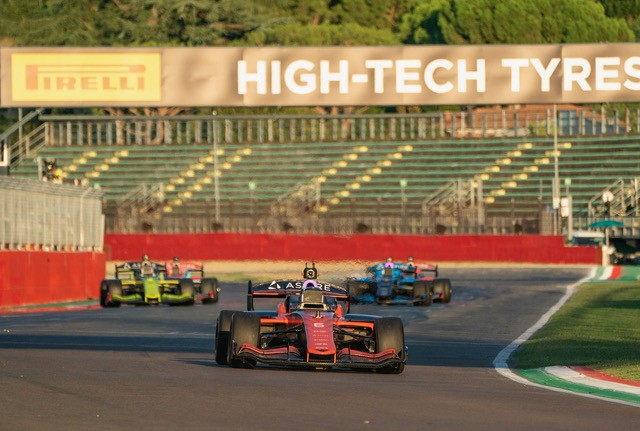Autonomous race cars at speed at Imola in the A2RL race