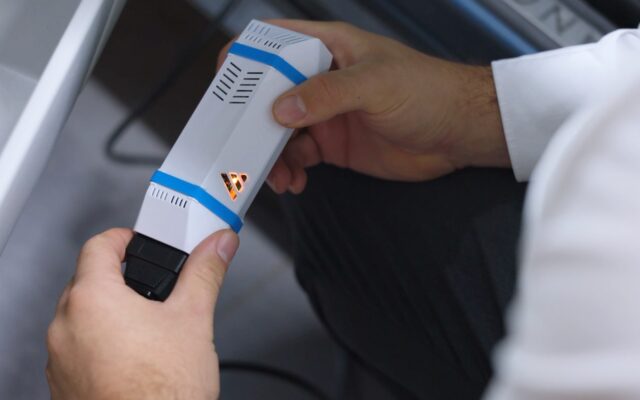 AVILOO FLASH Test device plugged into a car's OBD port