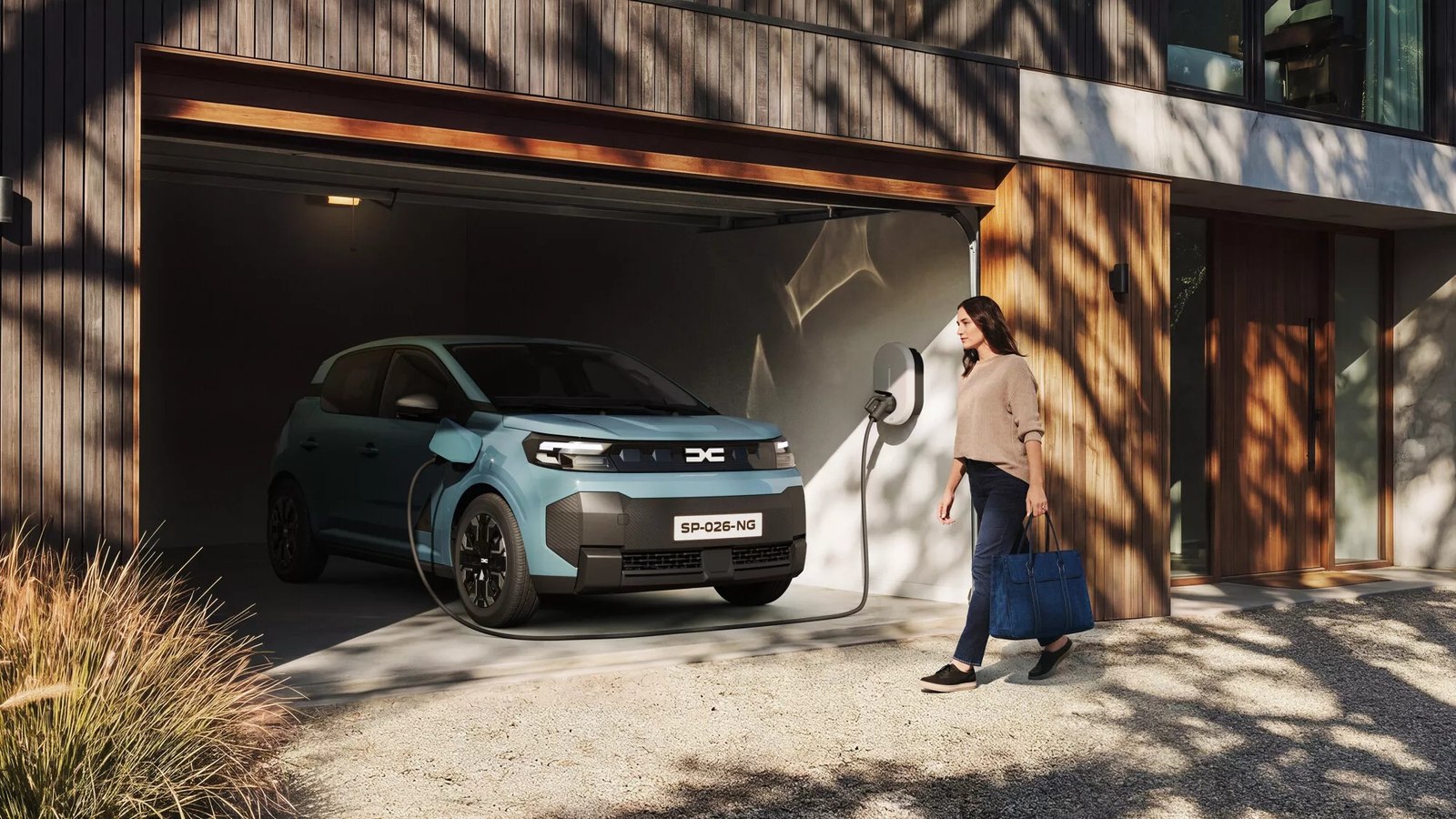 New Dacia Spring charging in a home garage