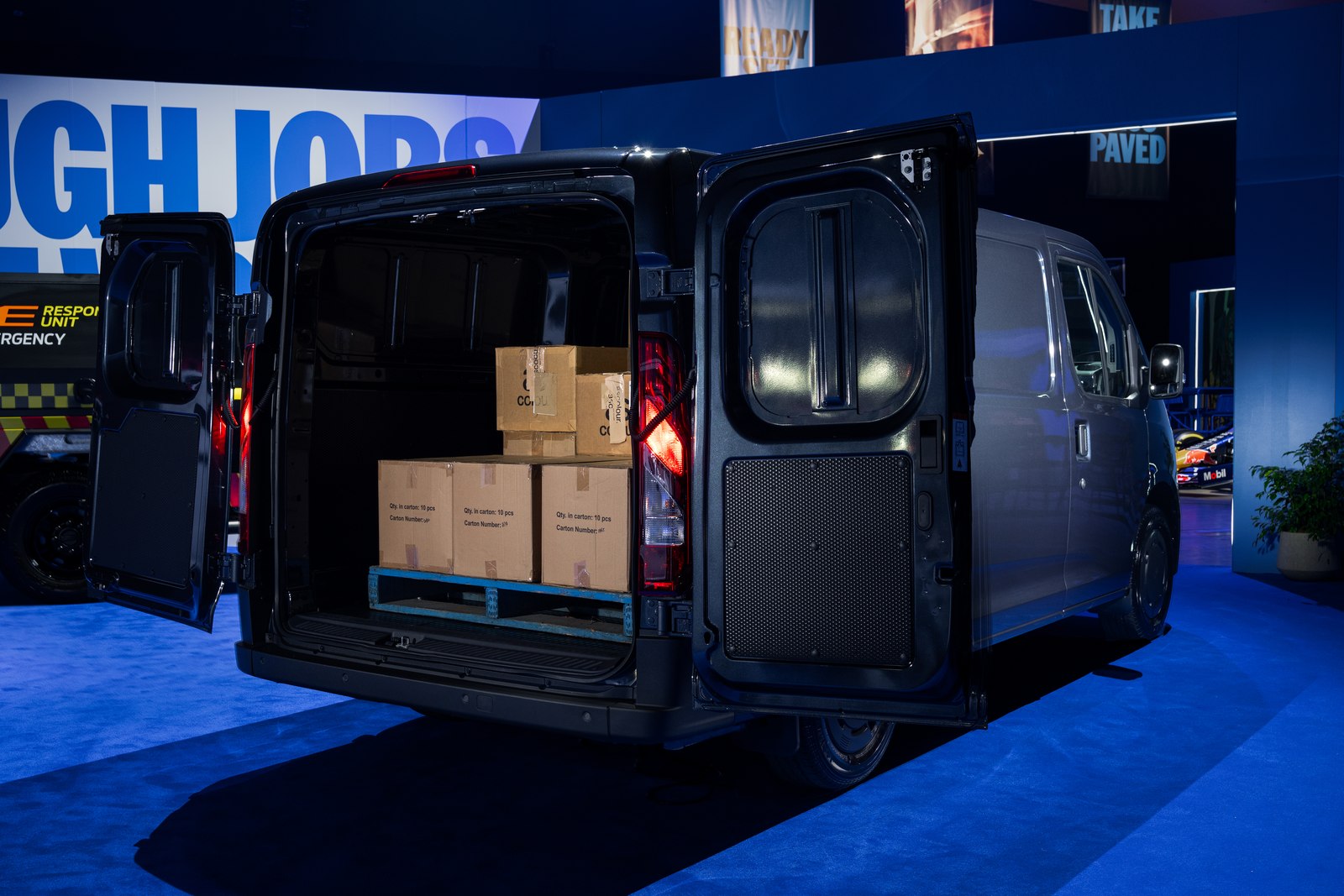 Ford Transit City with sliding side door and rear doors open showing boxes