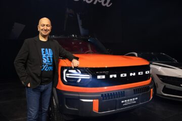 Ford Australia and New Zealand chief executive Fadi Mawal with the orange Bronco Basecamp on stage