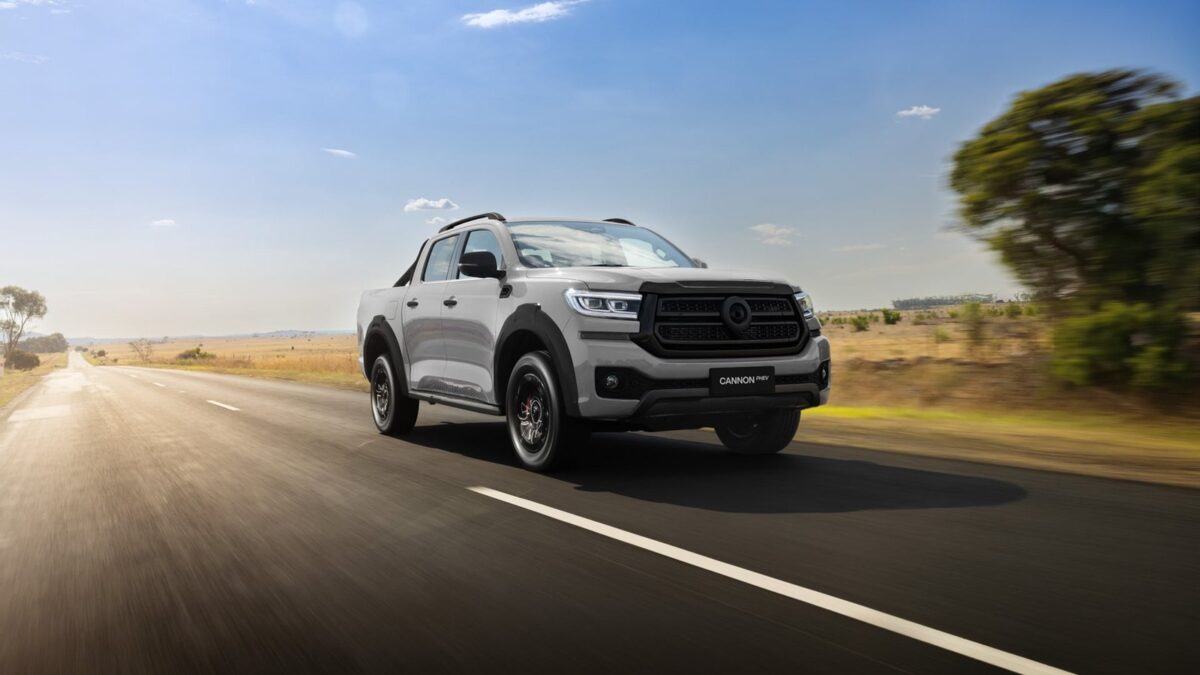Grey GWM Cannon Hi4-T PHEV ute driving on a country road