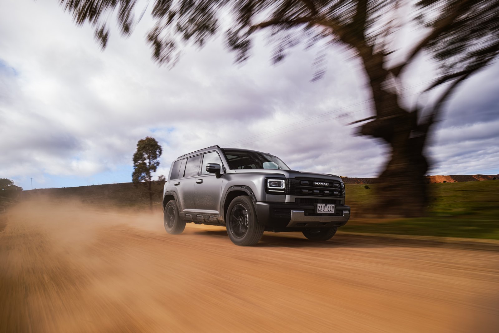 GWM Haval H7 driving fast on a gravel road