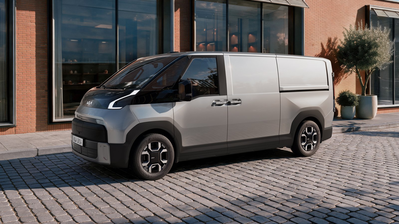 Kia PV7 Cargo van front three quarter on a cobbled street