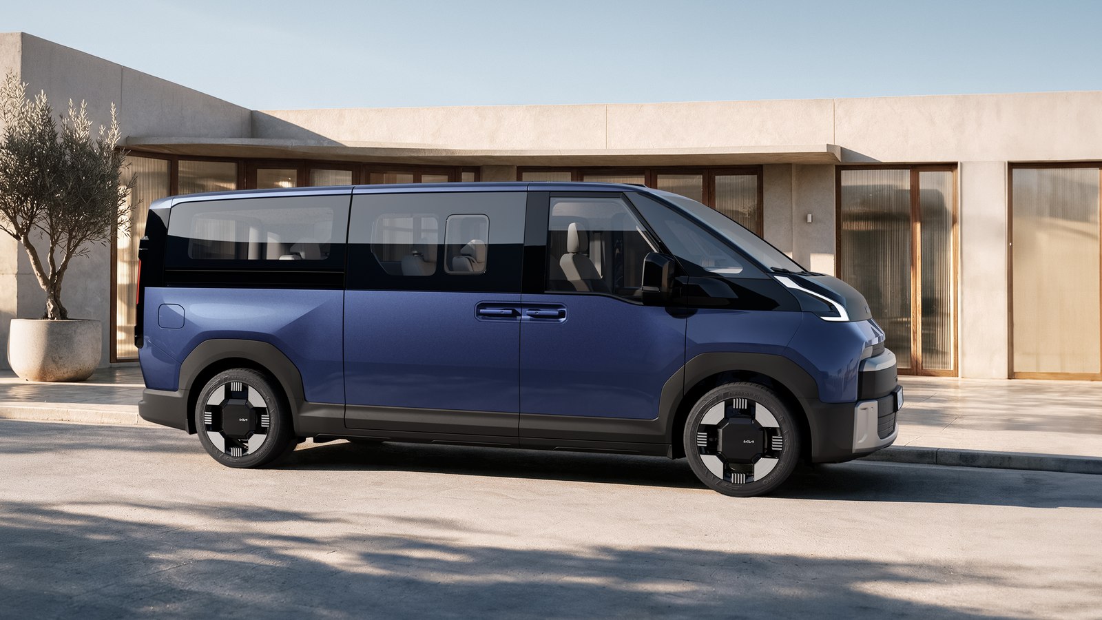 Blue Kia PV7 Passenger van side profile
