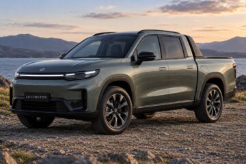 Digital render of a Leapmotor ute in olive green on a coastal road at sunset