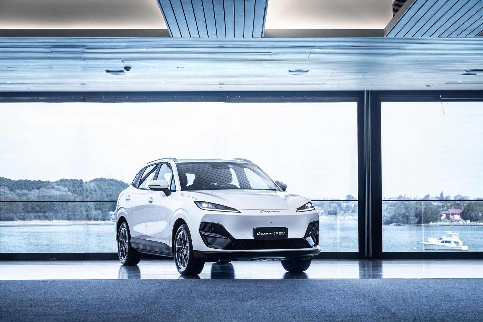 White Lepas L4 EV at a preview event