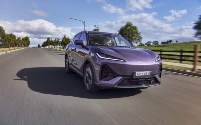 Purple Lepas L6 electric SUV driving on a rural road
