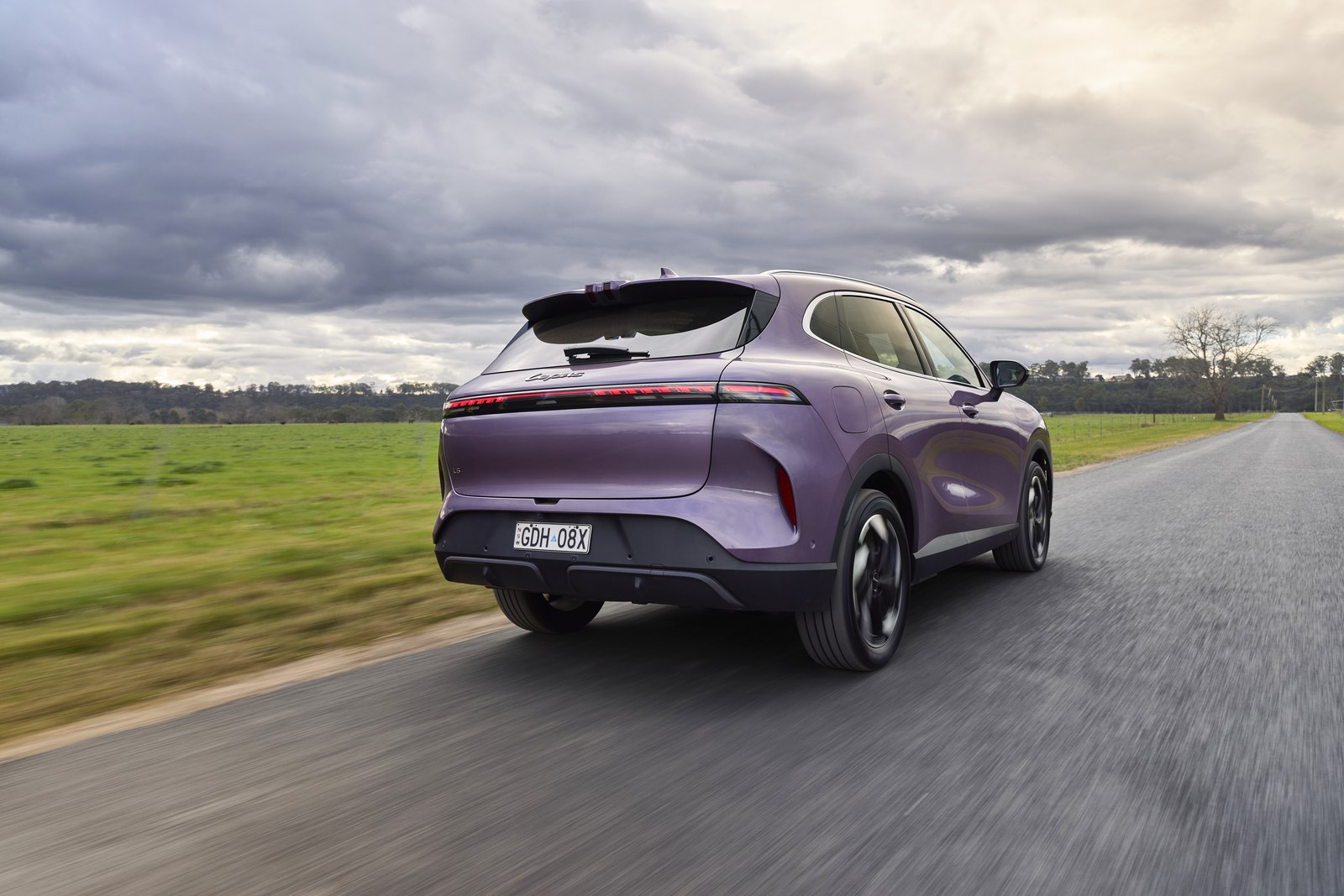 Purple Lepas L6 rear three quarter on a country road