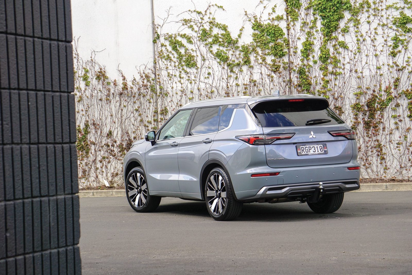 Rear view of a grey 2025 Mitsubishi Outlander VRX